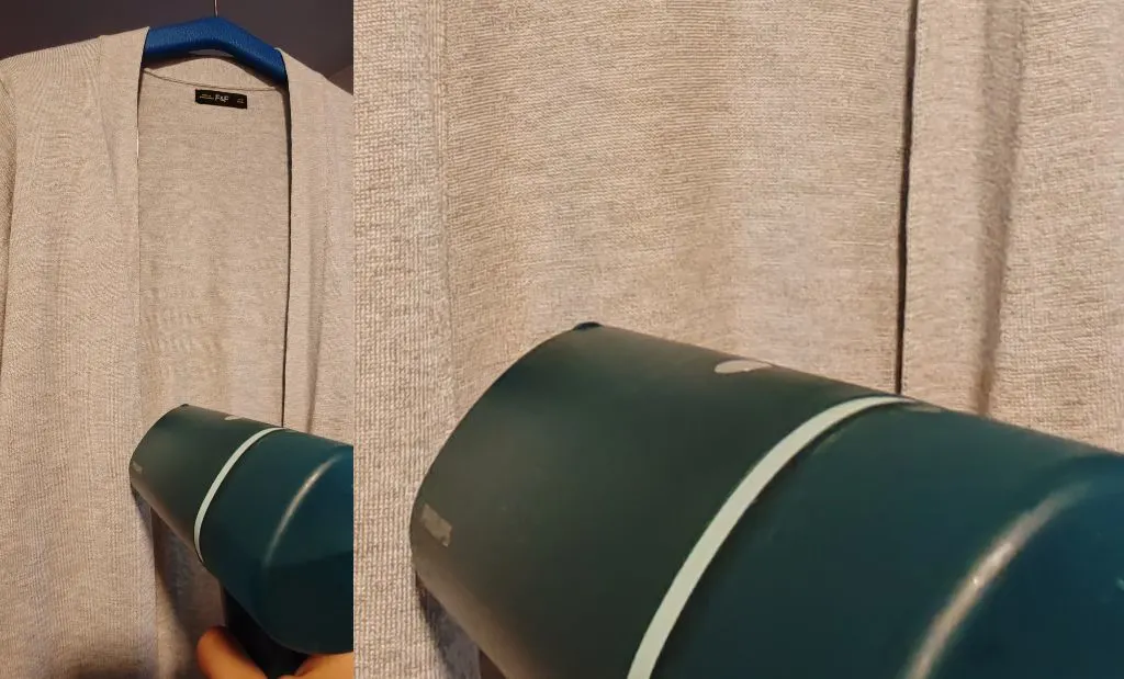 Sötétkék Philips kézi gőzölő használata szürke kardigán kisimításához