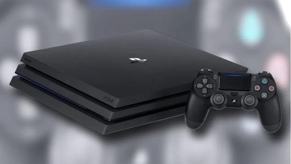 Ein schwarze Playstation 4 Pro-Konsole steht neben einem schwarzen Dualshock-Controller vor einem grauen Hintergrund.