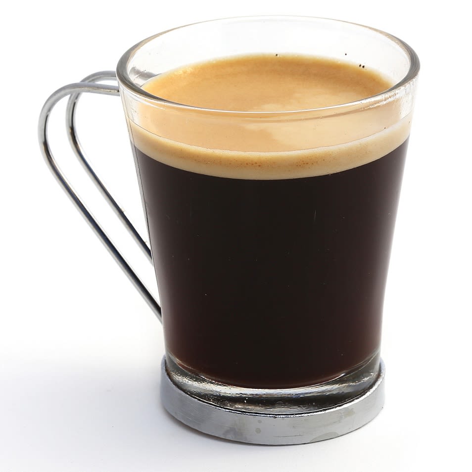 durchsichtige Tasse mit Kaffee und Crema