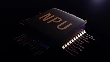 Dunkler Chip mit goldenen NPU-Buchstaben oben und goldenen Stiften an den Seiten auf dunklem Hintergrund.