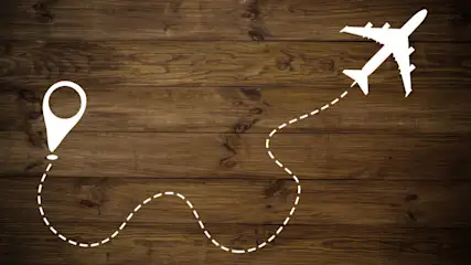 Auf Holz ist ein Flugzeug mit einer gestrichelten Linie zu einem Standortsymbol verbunden.