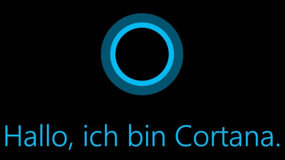 Der Cortana-Startbildschirm zeigt einen blauen Kreis und blaue Schrift auf schwarzem Grund.