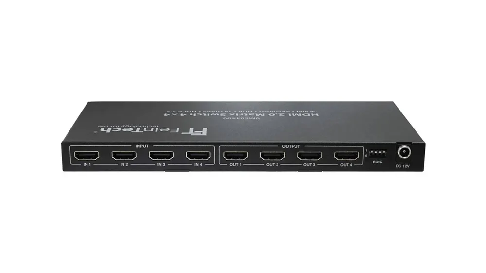 Eine schwarze FeinTech HDMI 2.0 Matrix Switch 4x4 Box mit Eingangs- und Ausgangsanschlüssen auf weißem Hintergrund.