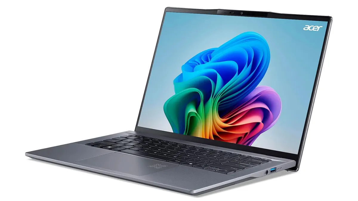 Das silberne Notebook Acer Swift Go 14 AI mit bunter Grafik auf dem Bildschirm.