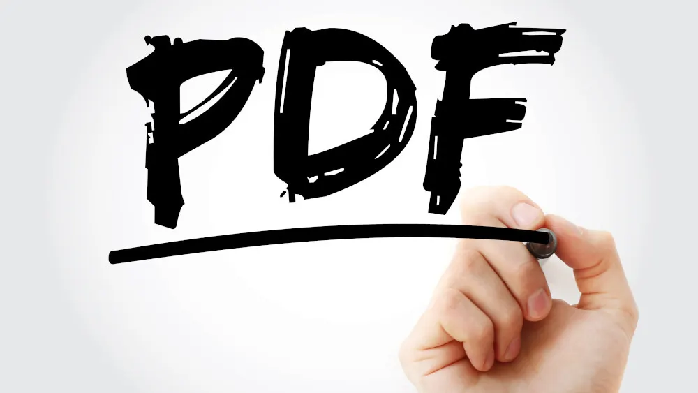 Eine Hand zieht eine schwarze Linie unter das Wort "PDF" vor einem hellgrauen Hintergrund.