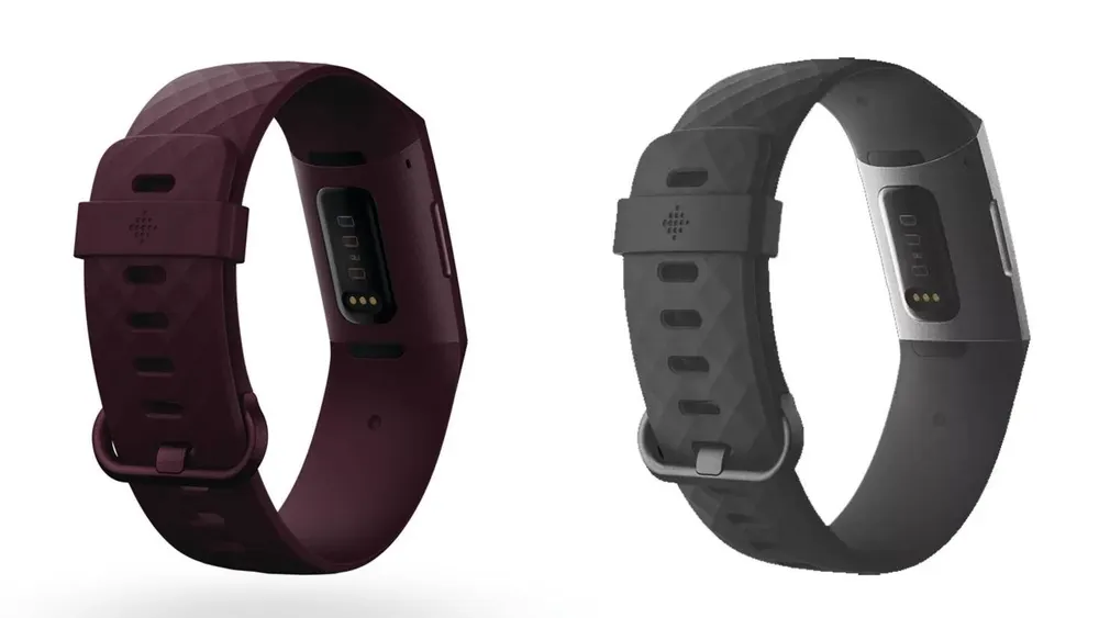 Zwei Fitness-Tracker liegen nebeneinander. Einer ist weinrot und der andere ist grau mit silbernen Akzenten. Beide haben Displays.