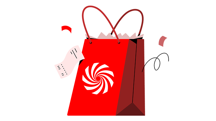 Eine rote Einkaufstasche mit weißen Zacken und Griffen. Ein Kassenbon hängt an der Tasche, kleine rote Schnipsel sind zu sehen.