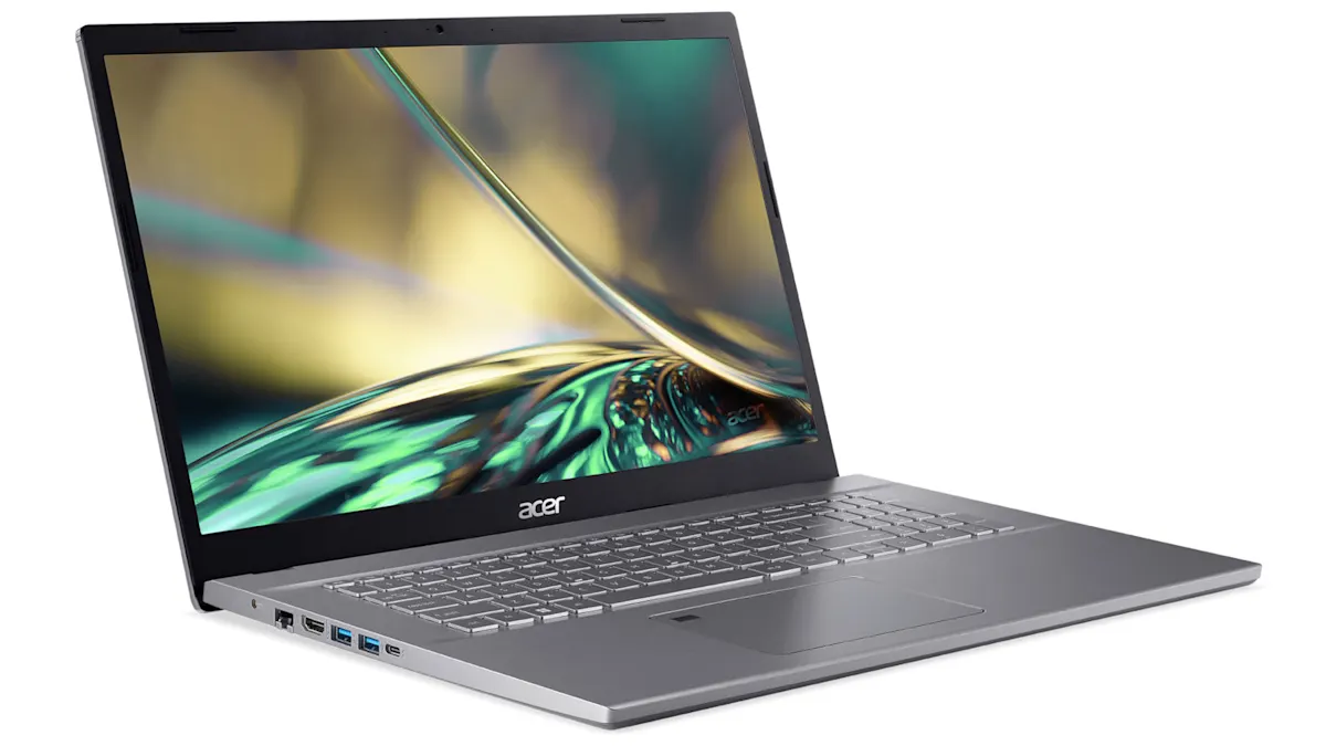 Ein grauer Acer Laptop ist geöffnet und zeigt einen abstrakten, farbenfrohen Bildschirmhintergrund. Tastatur und Anschlüsse sind sichtbar.