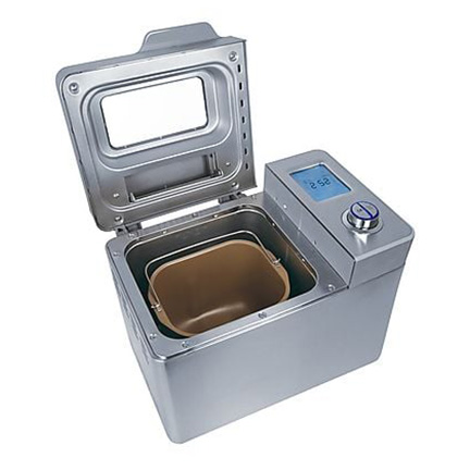 Kompakter Brotbackautomat aus Edelstahl mit geöffnetem Deckel, Backform innen, Display und Drehregler oben rechts.