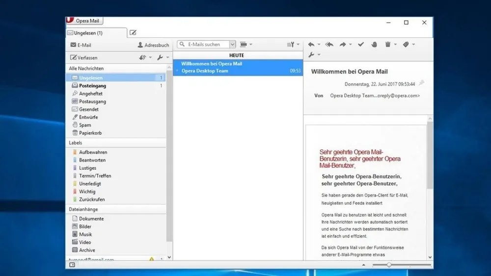 E-Mail-Client-Oberfläche mit Ordnern wie Posteingang, Entwürfe und Spam auf der linken Seite. Rechts ist eine E-Mail mit Text.