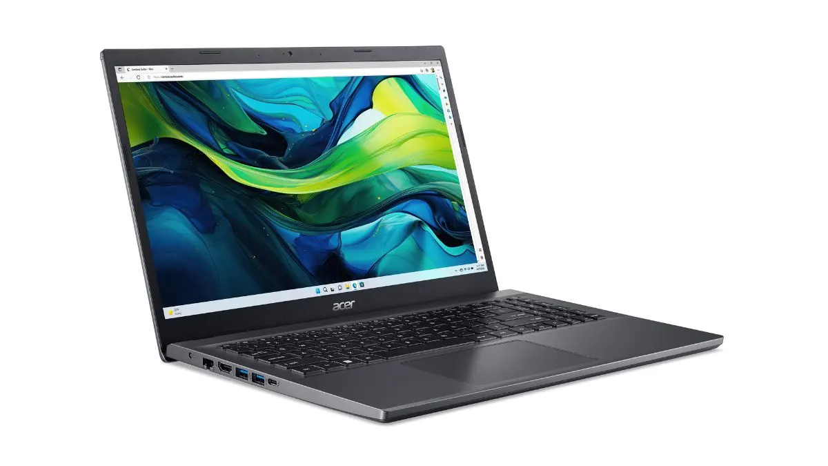Ein geöffneter, grauer Laptop steht vor einem weißen Hintergrund. Auf dem Bildschirm ist ein abstraktes blau-grünes Muster zu sehen.