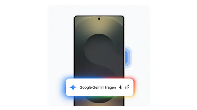 Smartphone mit großem „S“ auf dem Display, darüber eine Leiste mit dem Text „Google Gemini fragen“ sowie Symbolen für Mikrofon und Einstellungen, umgeben von farbigen Lichtakzenten in Blau, Rot, Grün und Gelb.