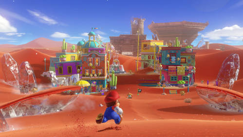 Mario rennt in einer Wüstenlandschaft im Hintergrund sind Gebäude zu sehen
