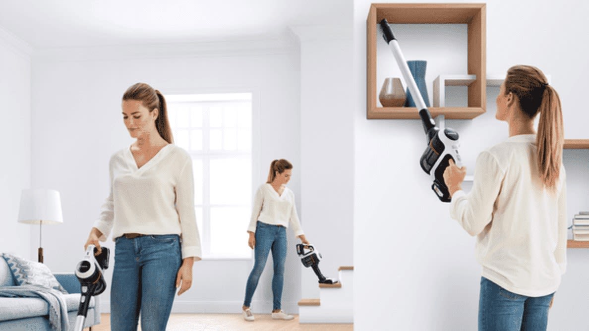 Frau saugt mit BOSCH BCS611AM Unlimited Serie 6 Stielsauger, Akkubetrieb am Boden, auf der Treppe und im Regal