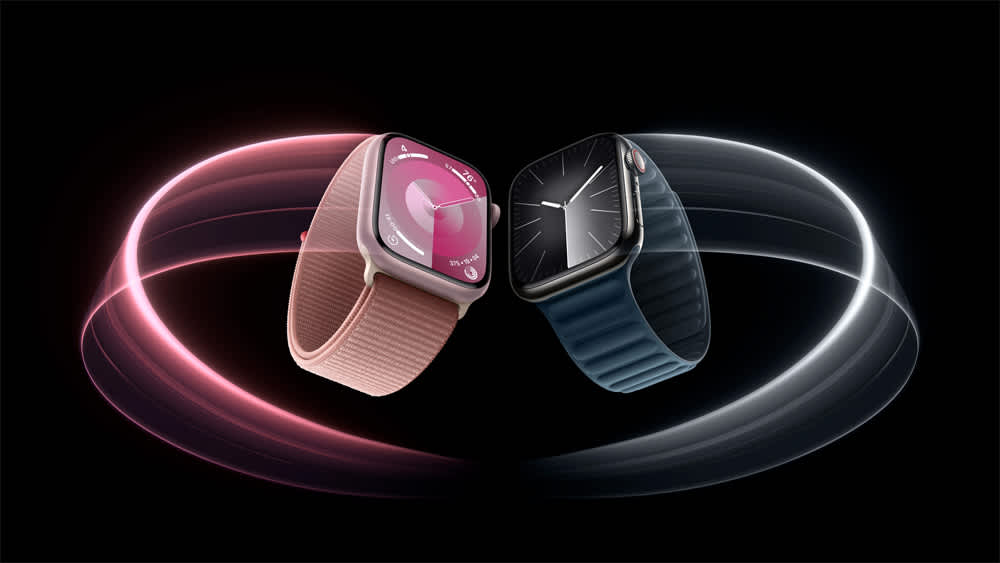 Zwei Apple Watch Series 9 in verschiedenen Farben werden von Lichtmalerei eingefasst.