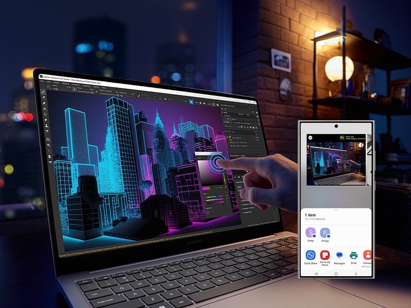 Ein Laptop zeigt eine Grafikdesign-Software mit einem Gebäude-Design in Blau und Lila. Ein Finger berührt den Bildschirm, daneben ein Smartphone.