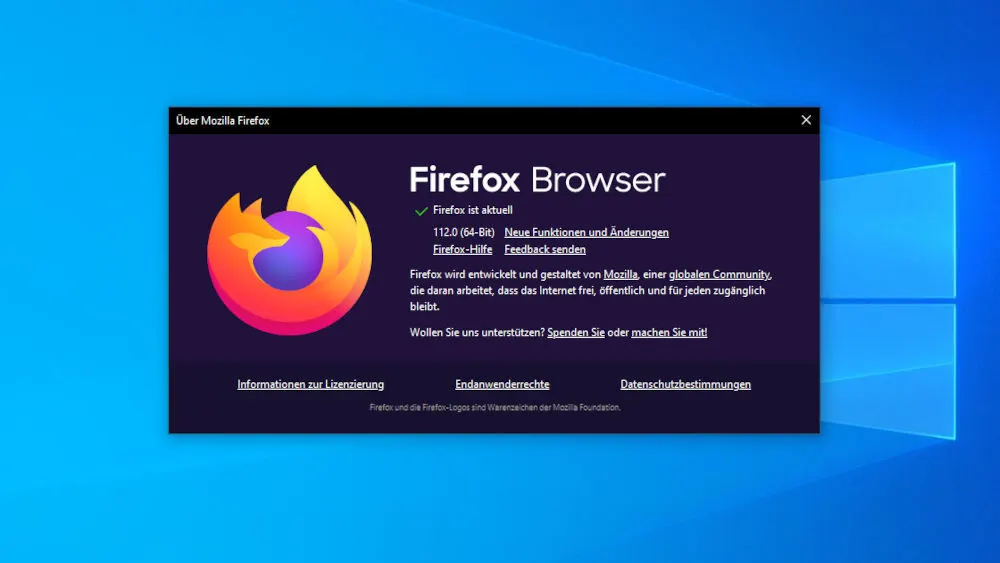 Ein Fenster "Über Mozilla Firefox" mit dem Firefox-Logo, Versionshinweisen und rechtlichen Informationen auf blauem Hintergrund.