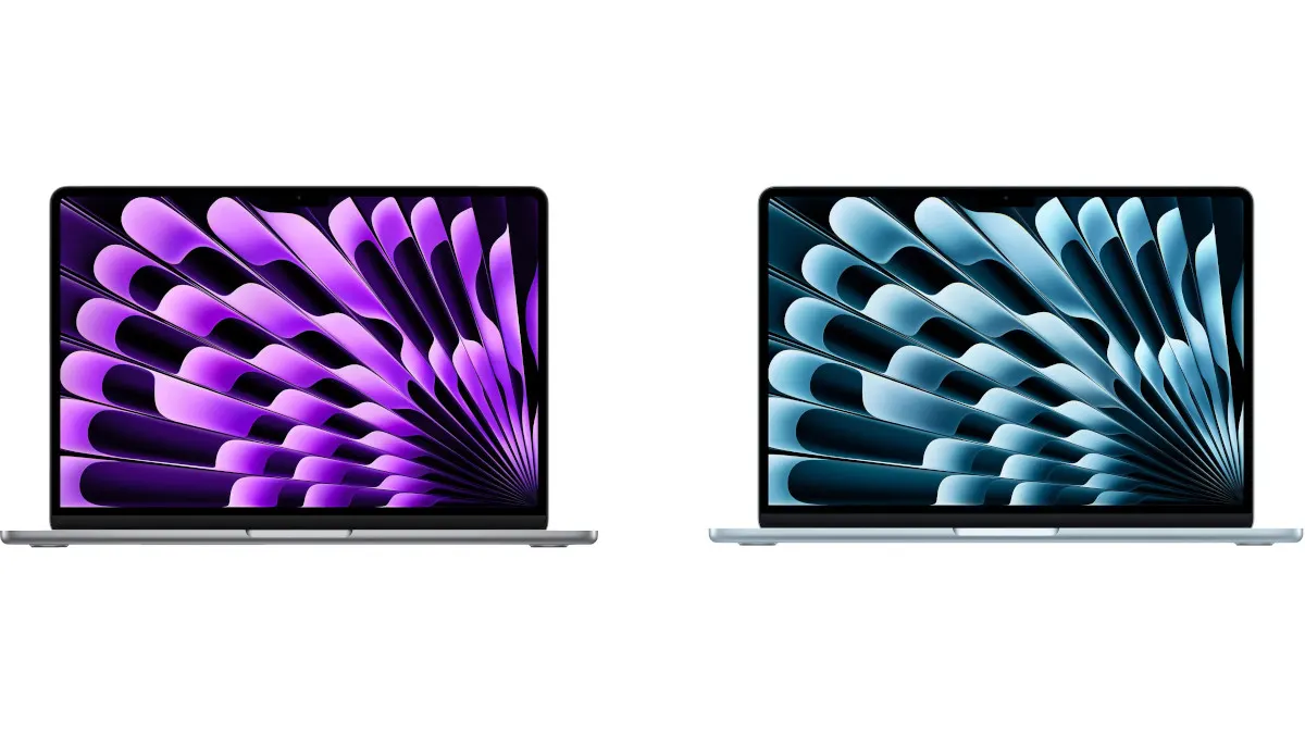 Zwei Laptops nebeneinander, einer mit einem violetten und der andere mit einem blauen, abstrakten Muster auf dem Bildschirm.