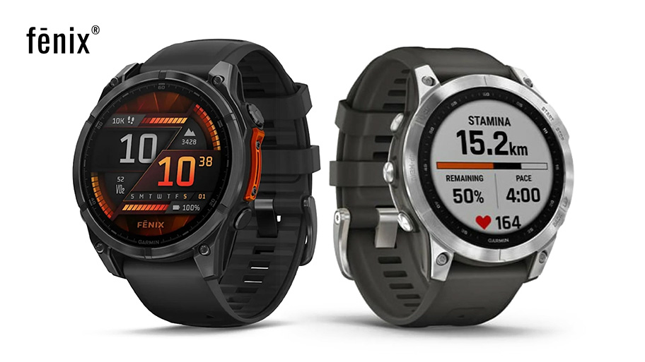 Dwa zegarki Fenix na białym tle. Jeden z czarnym paskiem i pomarańczowymi akcentami, drugi ze srebrną tarczą i brązowym paskiem.