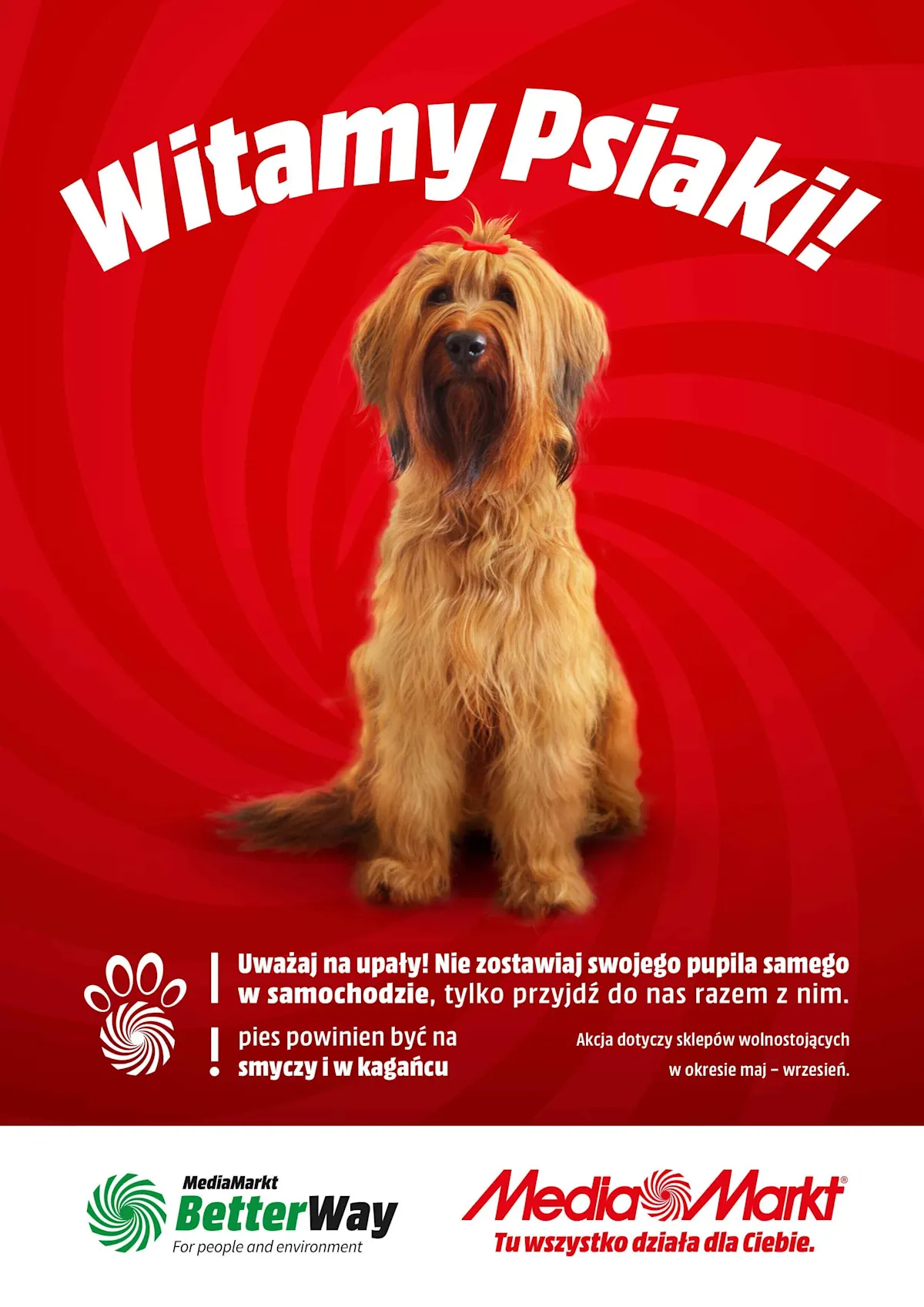 Na czerwonym tle siedzi kudłaty pies z czerwoną kokardką. Nad nim biały napis "Witamy Psiaki!". Na dole logo Media Markt i hasła.