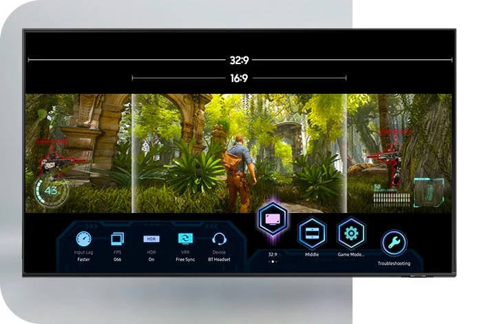 Ekran monitora wyświetla grę w dżungli z interfejsem użytkownika na dole z ikonami ustawień. U góry widoczne proporcje ekranu 32:9 i 16:9.