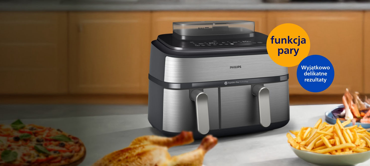 AirFryer stojący na blacie w kuchnii otoczony przez przygotowane potrawy 