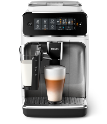 Ekspres do kawy Philips w kolorze białym i czarnym, z panelem dotykowym i szklanką latte macchiato na tacy ociekowej.