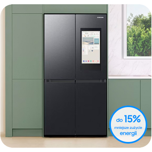 Czarna lodówka Samsung z ekranem dotykowym stoi obok zielonej szafki kuchennej, obok okno. Reklama: "do 15% mniejsze zużycie energii".
