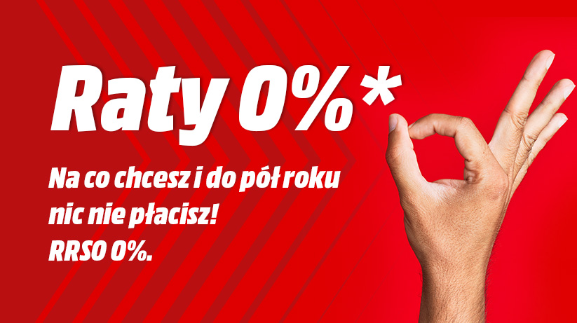 Czerwone tło z białym tekstem "Raty 0%*" i hasłem reklamowym. Prawa ręka pokazuje gest "OK".