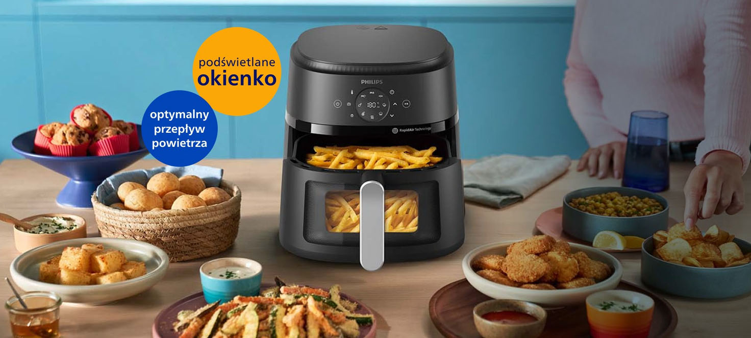AirFryer stojący na blacie w kuchni dookoła przygotowanych potraw