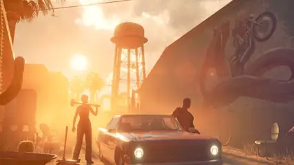 Na zdjęciu widoczna jest ulica z samochodem, wieżą ciśnień i osobami na tle zachodzącego słońca. Po lewej stronie widoczny jest kaktus.