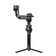 Czarny, elektroniczny stabilizator kamery z trzema nogami na białym tle.