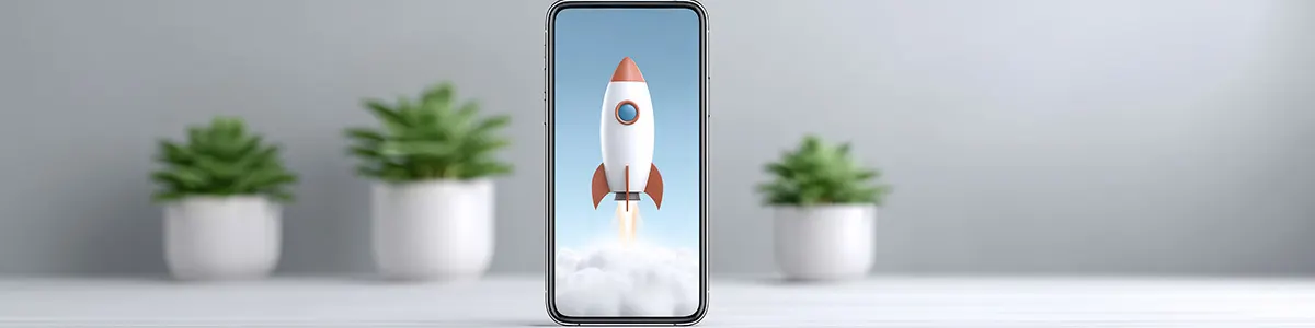 Smartfon wyświetlający na swoim ekranie lecącą rakietę.