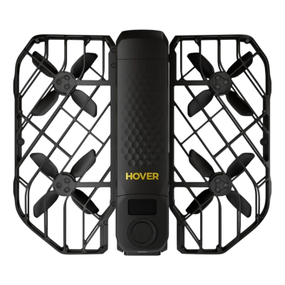 Drone quadricoptère noir avec grille de protection et quatre hélices, vue de dessus; inscription «HOVER» en jaune, fond isolé.