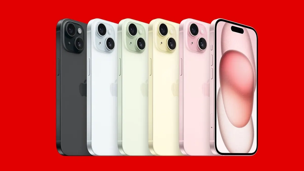 Su sfondo rosso, sei iPhone disposti in fila mostrano i lati posteriori e lo schermo. I colori includono nero, bianco, verde, giallo e rosa.