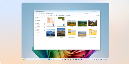 Ein Computerbildschirm zeigt ein geöffnetes Dateiordner-Fenster mit diversen Bild- und Ordner-Symbolen vor einem blauen Hintergrund und einer farbenfrohen Grafik unten.