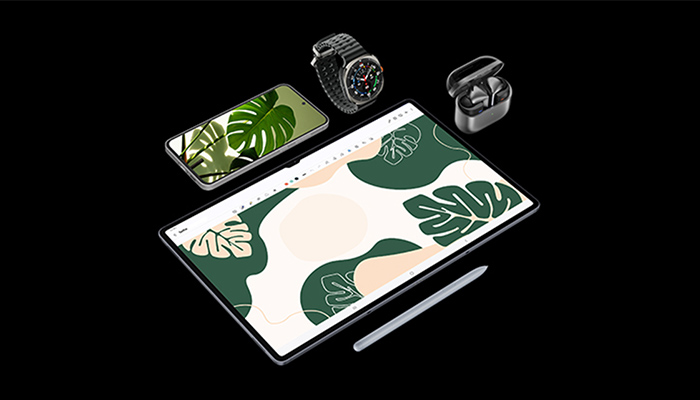 Auf schwarzem Grund liegen ein Tablet mit Stift, ein Smartphone, eine Smartwatch und Ohrhörer. Die Bildschirme zeigen grüne Blätter.