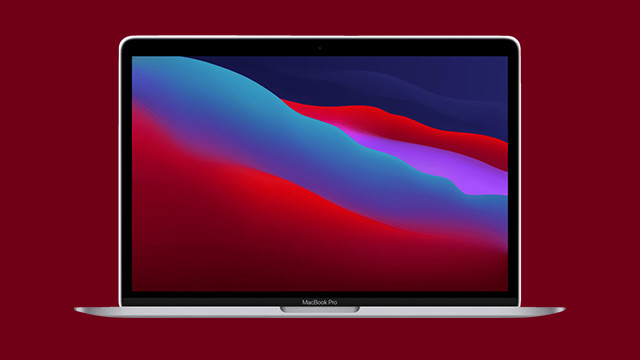 Ein silbernes MacBook Pro ist auf einem weinroten Hintergrund zu sehen. Der Bildschirm zeigt ein abstraktes, farbenfrohes Hintergrundbild.