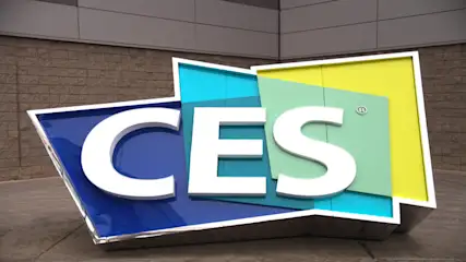 Ein großes, farbenfrohes CES-Logo mit weißen Buchstaben auf blauen, türkisen, hellgrünen und gelben Flächen.