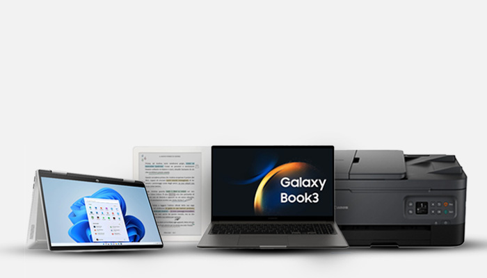 Un computer portatile, un tablet, dei fogli e una stampante su sfondo bianco.