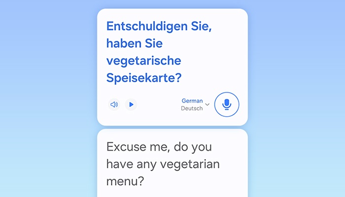 App di traduzione con testo in tedesco e inglese: "Avete un menù vegetariano?". Icone audio e microfono.