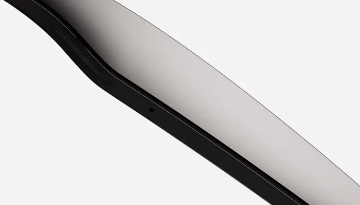 Vista angolata di un dispositivo con cornice nera e schermo grigio chiaro su sfondo bianco.