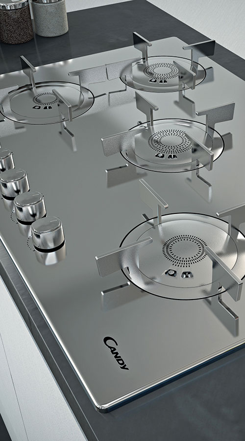 Piano cottura in metallo con quattro fuochi e manopole di controllo. Sul piano � visibile il logo del marchio Candy.