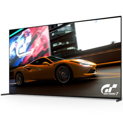 TV che mostra una macchina arancione su una pista, con un logo GT in basso a destra.