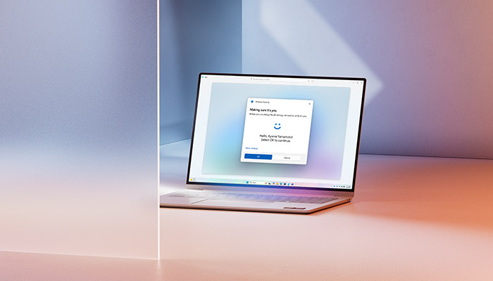 notebook posizionato tra due muri, con schermata di windows hello