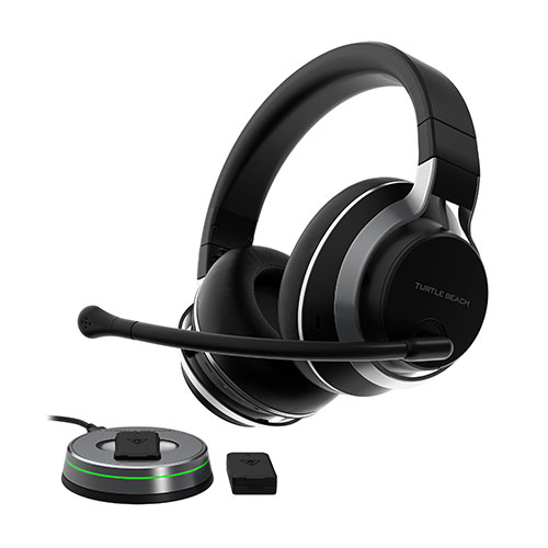 Cuffie nere con microfono, base rotonda grigia con striscia verde e accessorio nero.