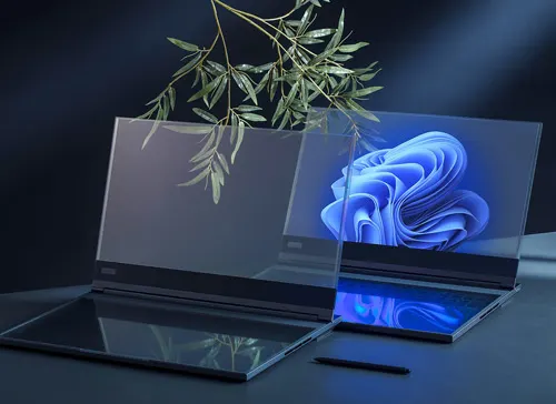 Due computer portatili su un tavolo scuro. Lo schermo di uno mostra un'immagine astratta blu. Una pianta è dietro i computer.