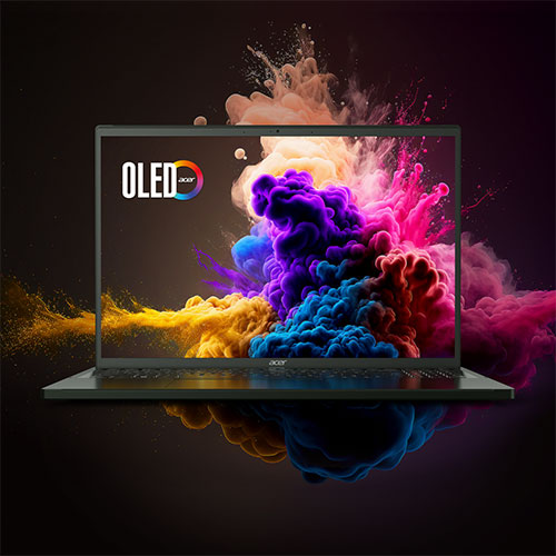 Schermo OLED con nuvole colorate (giallo, blu, viola, rosa) su sfondo scuro. Riflesso dello schermo sulla superficie lucida.