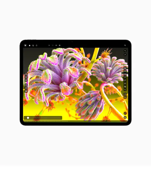 Tablet nero con sfondo di fiori viola e giallo.