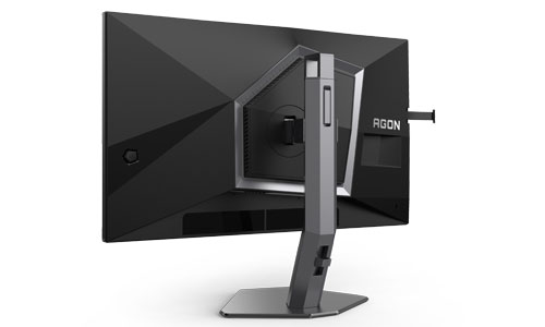 Vista posteriore di un monitor nero con supporto grigio su sfondo bianco.